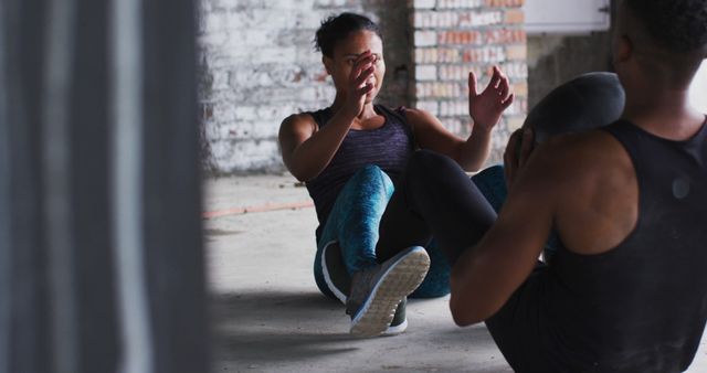 People Engaging In Partner Exercises In Industrial Gym Setting - Download Free Stock Images Pikwizard.com