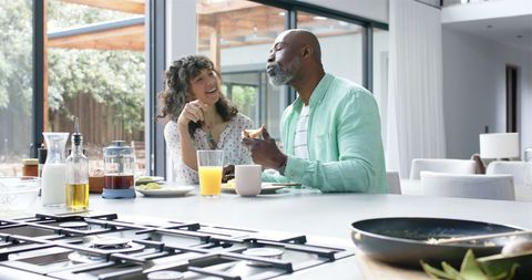Happy Couple Enjoying Breakfast at Modern Kitchen Table - Download Free Stock Images Pikwizard.com