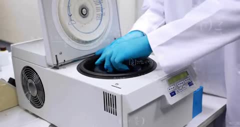 Scientist Operating Laboratory Centrifuge with Animated Formulas