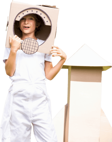 Boy imagining as astronaut with cardboard, transparent background