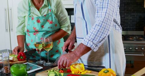 Caucasian Couple Enjoying Cooking Together in Kitchen