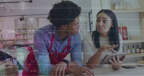 Cafe team analyzing sales statistics using tablet