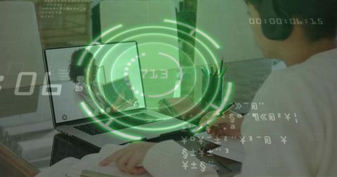 Teen studying online wearing headset and sweater, laptop tutor with green hud overlay, notetaking