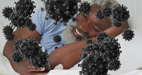 Senior Relaxing in Bed Viewing Smartphone with Virus Representation