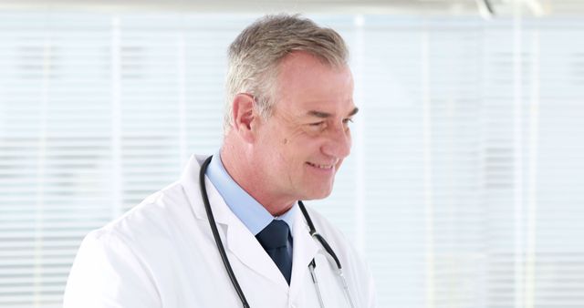 Confident Middle-Aged Doctor in Clinical Environment - Download Free Stock Images Pikwizard.com