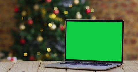 Laptop with Green Screen Near Holiday Christmas Tree Indoors - Download Free Stock Images Pikwizard.com
