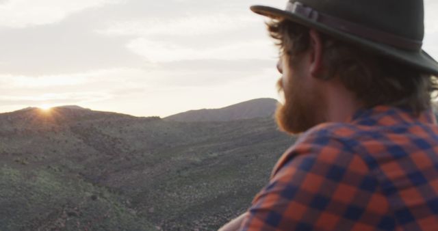 Man Watching Sunset Over Mountain Range Admiring Nature - Download Free Stock Images Pikwizard.com