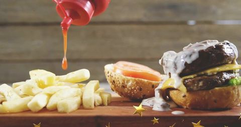 Double beef burger melting cheddar and creamy sauce with dripping ketchup and fries