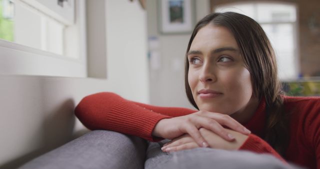 Thoughtful Woman Relaxing on Couch Looking Out Window - Download Free Stock Images Pikwizard.com