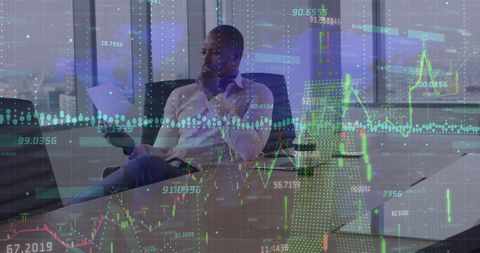 Businessman Analyzing Digital Financial Reports in Modern Office