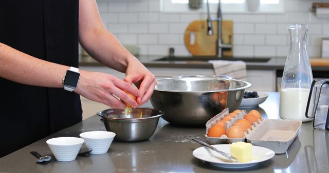 Person Cracking Egg in Modern Kitchen for Homemade Cooking - Download Free Stock Images Pikwizard.com