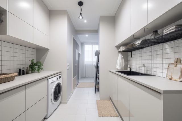 General view of modern utility room with white furniture, created using generative ai technology. Utility room, home decor and interiors concept digitally generated image.