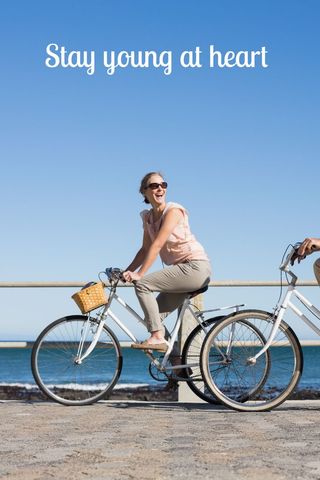 Joyful Woman Cycling by Sea Capturing Vitality and Happiness - Download Free Stock Templates Pikwizard.com