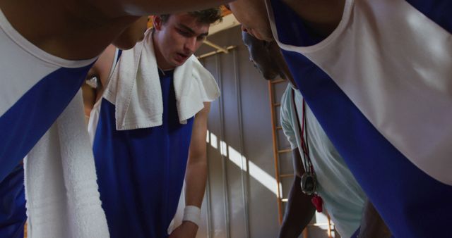 Basketball Team Huddling During Timeout in Locker Room - Download Free Stock Images Pikwizard.com