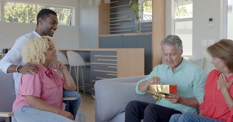 Family celebration: elders delighted with surprise gift