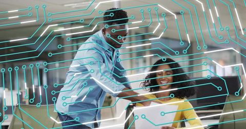 Team collaborating over documents in modern office with turquoise circuit network overlay