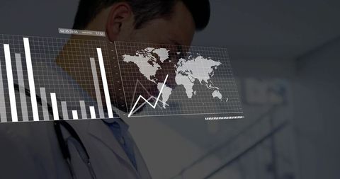 Physician reviewing global health analytics overlay with charts and world map in clinic