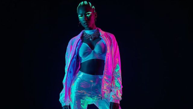 Futuristic fashion model in neon glow