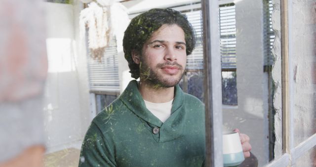 Man with Beard Holding Coffee Cup Looking Through Window - Download Free Stock Images Pikwizard.com