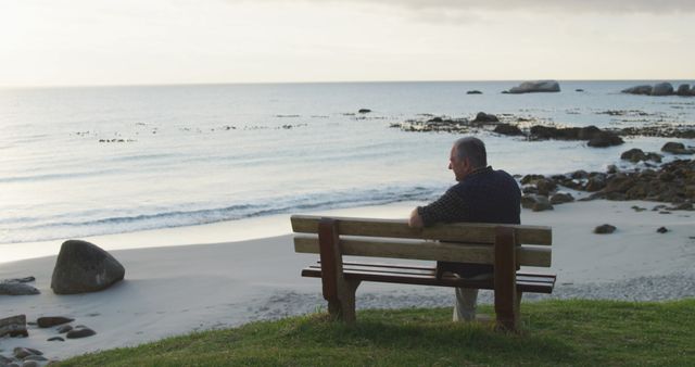 Solitary Senior Man Reflecting on Seaside Bench at Sunset - Download Free Stock Images Pikwizard.com