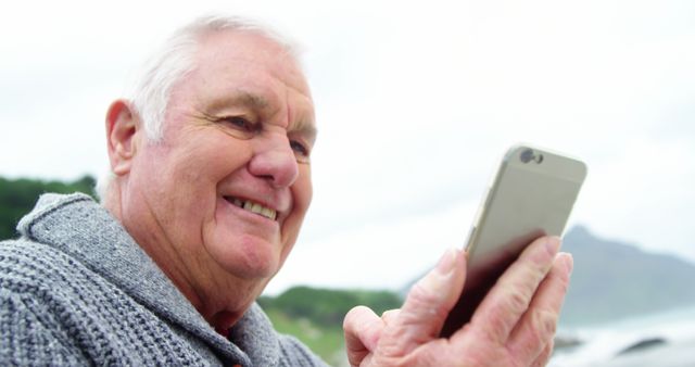 Senior man enjoying using smartphone outdoors - Download Free Stock Images Pikwizard.com
