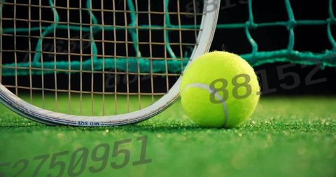 Tennis Ball and Racket Frame on Green Court with Copy Space