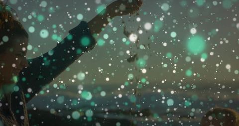 Mother bonding with child on shoreline during beautiful dusk