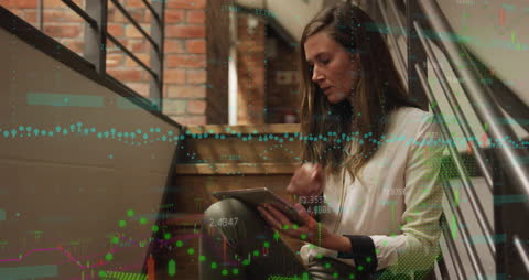 Businesswoman Analyzing Data with Digital Tablet