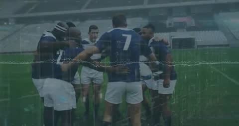 Team of Rugby Players Huddling in Rain Demonstrating Unity