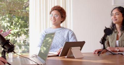 Diverse Coworkers Collaborating in Modern Meeting Room Setting
