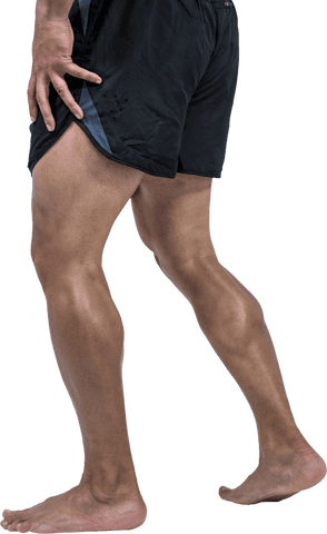 Transparent View of Athletic Male Legs in Black Shorts