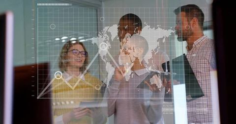 Business Team Analyzing Data on Transparent Glass Wall