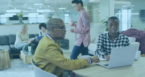 Diverse Team Collaborating on Laptop with Financial Data Overlay