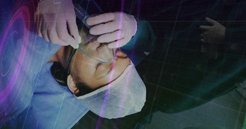 Paramedic holding oxygen mask over patient receiving emergency care on stretcher with data overlay