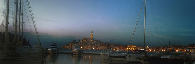 Coastal City Skyline with Marina and Sailboats in Evening - Download Free Stock Images Pikwizard.com