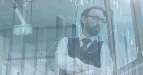 Reflective Businessman Analyzing Data Projections in Corporate Office