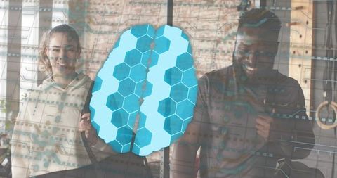 Collaborating duo holding virtual hexagonal brain overlay while training in loft studio
