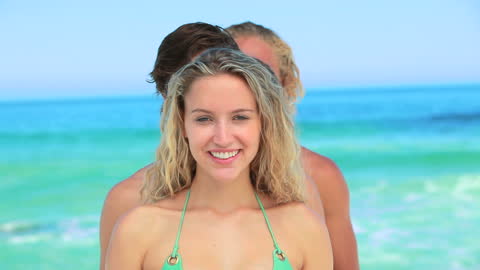 Group of Friends Forming a Line at Sunny Beach