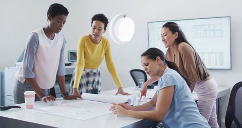 Diverse Businesswomen Collaborating on Project in Creative Office - Download Free Stock Images Pikwizard.com