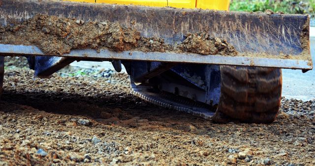 Close-up of Bulldozer with Tracks Moving Dirt at Construction Site - Download Free Stock Images Pikwizard.com