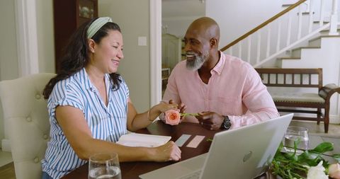 Senior diverse couple sharing heartfelt moments at home