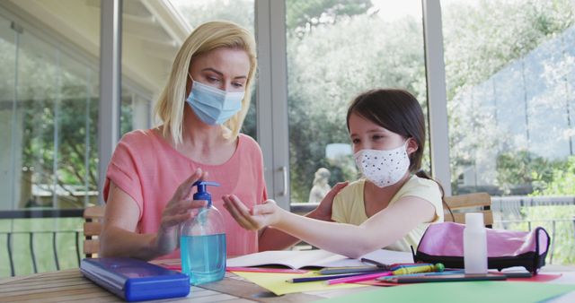 Mother and Daughter Practicing Hand Hygiene While Studying - Download Free Stock Images Pikwizard.com