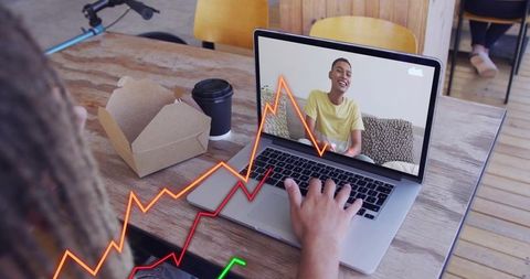 Remote collaboration in cafe with laptop video call, smiling participant, analytics overlay