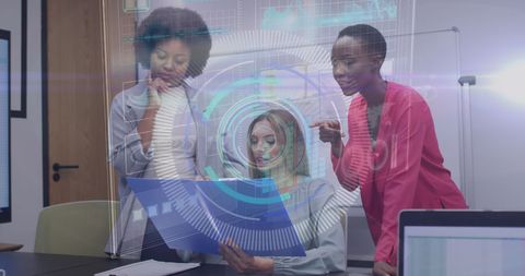 Three diverse women analyzing business data with futuristic interface