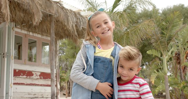 Smiling children enjoying summer day outdoors at rustic beach hut - Download Free Stock Images Pikwizard.com