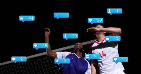 Dual volleyball athletes receiving social media reaction icons at night