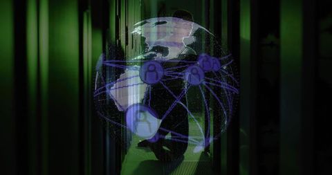 It technician with holographic globe in server room