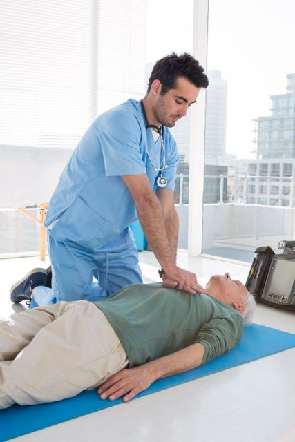 Doctor performing CPR on patient in modern clinic. Useful for illustrating emergency medical procedures, healthcare training, first aid techniques, and life-saving interventions. Ideal for medical education materials, healthcare websites, and emergency response guides.
