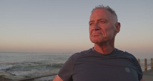 Confident Senior Man Standing by Ocean At Sunset - Download Free Stock Images Pikwizard.com