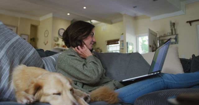 Woman Working from Home on Sofa with Sleeping Dog - Download Free Stock Images Pikwizard.com